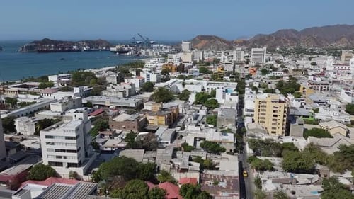 Santa Marta container sea port in sunny Colombian city low aerial
