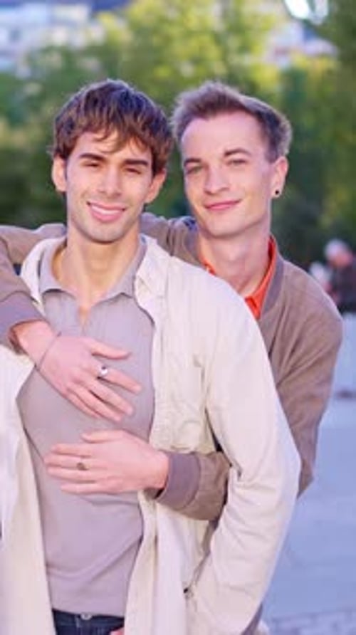 Romantic Gay Couple Hugging and Smiling Outside