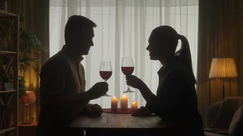 The Couple Rounds Off a Romantic Evening By Candlelight The Dark Silhouettes of a Man and a Woman