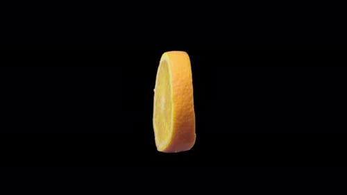Half orange spinning on black background
