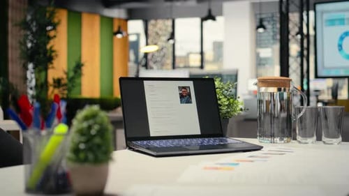 Modern Desk with Laptop in Empty Office Shows Applicant CV
