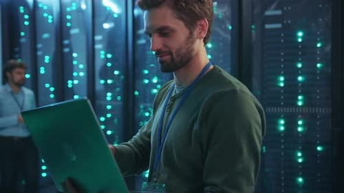 A Highly Skilled Professional is Engaged in Work Related to a Data Center Utilizing a Laptop