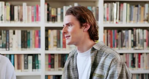 Talking, students or man in library for education, knowledge or study group for college project