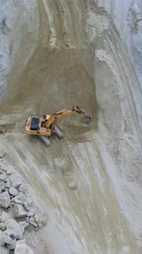 An Excavator is Actively Working on a Construction Site to Perform Various Tasks and Operations