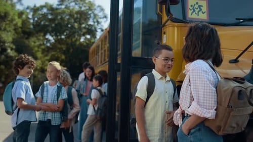 Diverse elementary students joyfully boarding yellow school bus after classes