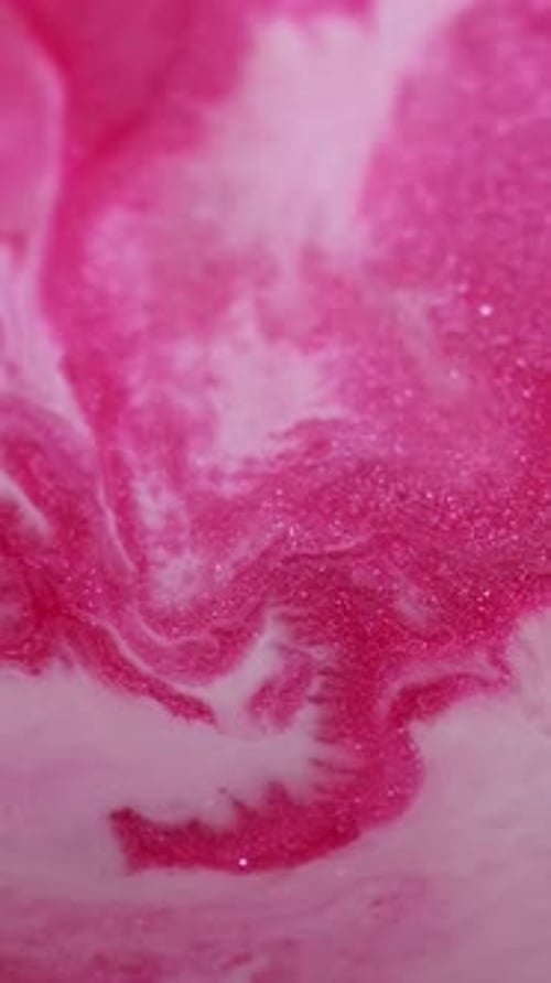 Abstract pink and white glittery liquid motion background