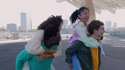 Mixedrace Young People Having Fun Together at City Street