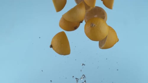 Vibrant Sliced Lemons Floating on a Light Blue Background