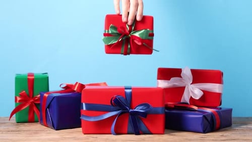 Colorful Wrapped Gifts with Ribbon on Wooden Table