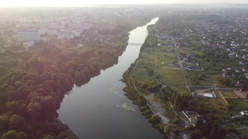 Panoramic View River in City with Calm Surface Summer Morning Aerial Drone View