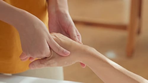 Woman Receiving Hand Massage at Spa
