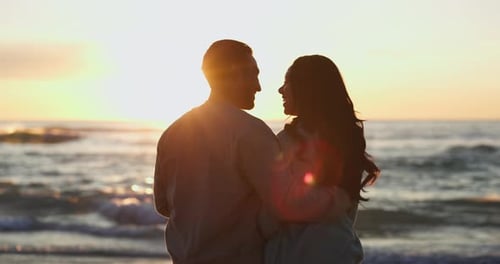 Love, sunset and silhouette of couple at beach for relax, summer vacation and travel