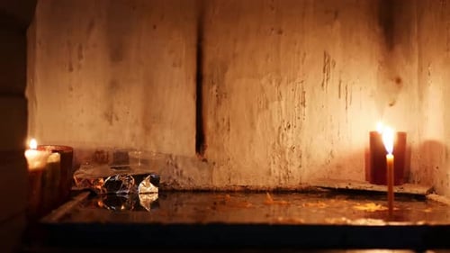 Candles Burning in a Dimly Lit Space