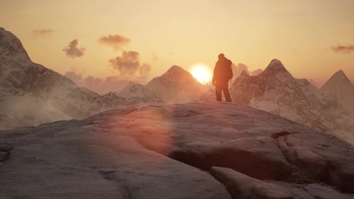 Adventure Man Looking at Rocky Mountain Landscape