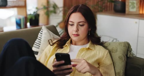 Phone, scrolling and social media with woman on sofa in living room of home for post or update