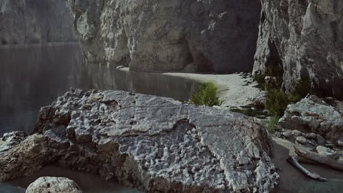 Sandy Beach in Bay Surrounded By Steep Mountains in Sunset