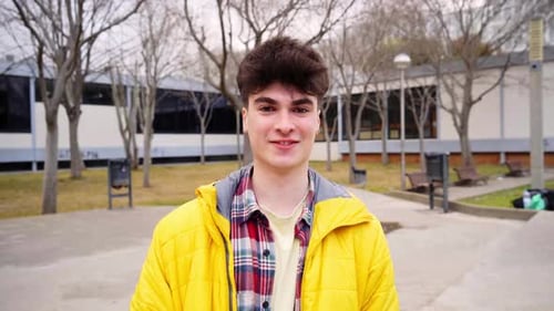 Young Student Boy Looking Positive at Camera Outdoors Teenager Posing in High School Playground