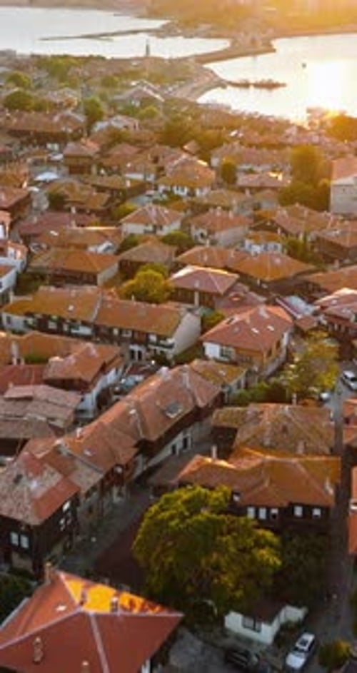 Aerial drone view of the old town Nessebar, Bulgaria at sunset. Vertical