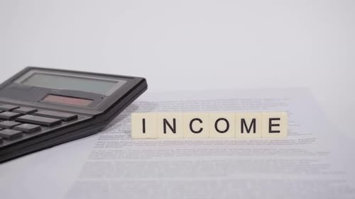 Word INCOME on scrabble