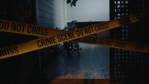 Crime Scene Tape Blocking Entrance at Night