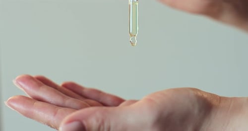 Liquid Dropping onto a Palm in a Close Up