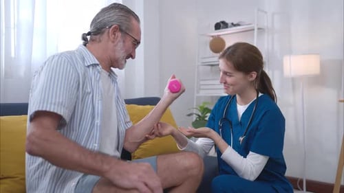 Senior Man Exercising with Young Adult Health Professional