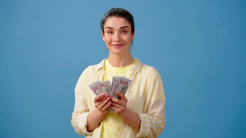 Rich Female Counts Dollar Bills Smiling Cheerfully