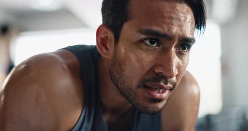 Man, breathing and sweat in gym for fitness, exercise and break with challenge, cardio and workout