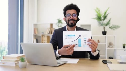 Indian Businessman Presenting Data