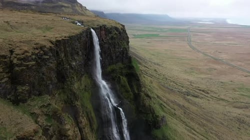 Aerial View of Majestic Waterfall in Iceland