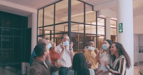 Business people, teamwork and throwing face mask in air for end of covid together at the office