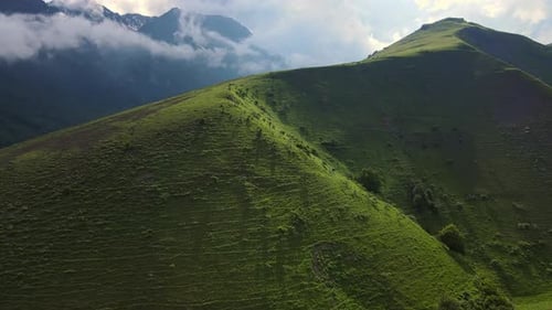 Aerial View of the Mountainside and Beautiful Alpine Green Meadows