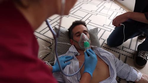 Man Receiving Oxygen Treatment at Home