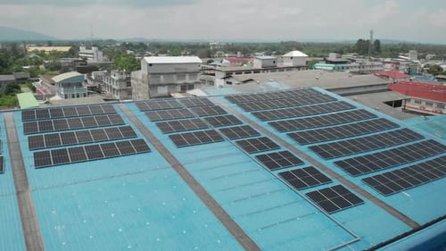 Aerial view of solar cell panels installed on roof of the factory