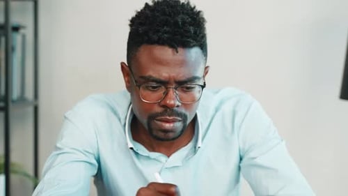 Professional Man Working on Tablet with Stylus