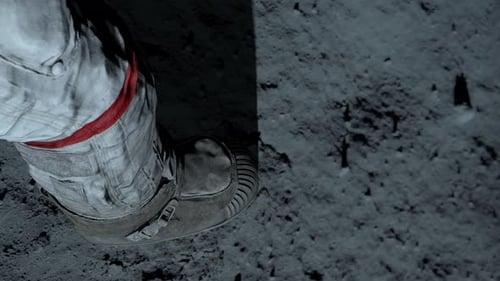 Astronaut Boot Stepping on Moon Surface Leaving Footprint