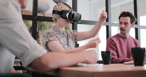 Woman Using VR Headset During Office Meeting