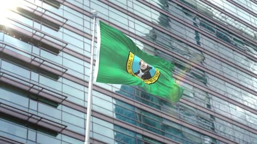 Washington State Flag Waving with Corporate Building Backdrop