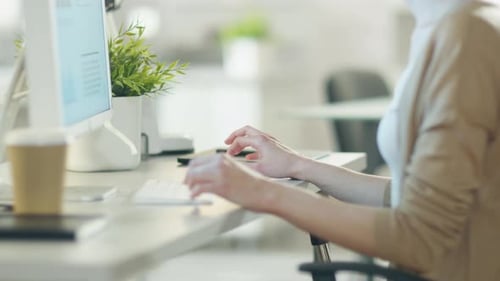 Close-up of Woman's Hands Typing on a Keyboard Using Her Personal Computer in Very Lightsome Modern