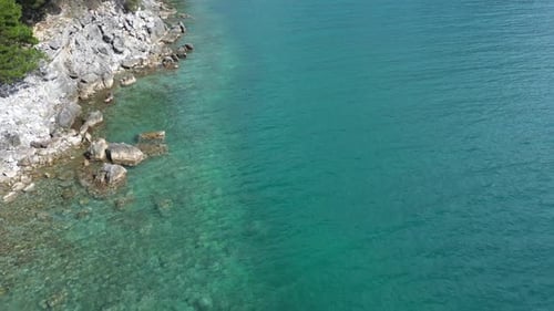 The drone flies over the sea. Beautiful clear water of the Adriatic Sea off the coast of Croatia.