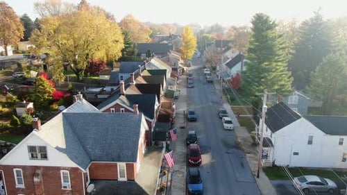 Suburban Street Aerial View with American Flags