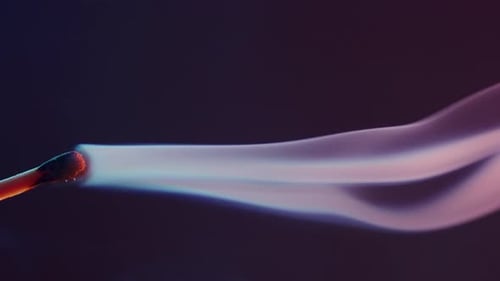 White Smoke From an Extinguished Match on Dark Background