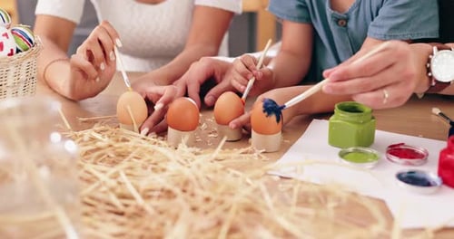 Easter, painting and parents with children and eggs for holiday, festival celebration