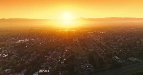 Sunlit panorama of Napa city, California, USA. Drone footage over the valley