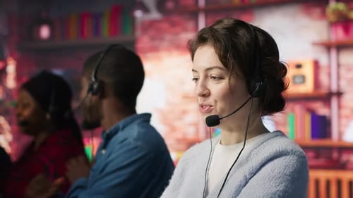 Cheerful Call Center Employee Wearing Audio Headset Assisting Customers