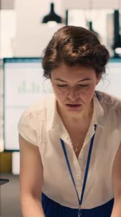 Vertical Video Diverse Work Team Reviewing Business Intelligence Reports and Forecasting Data