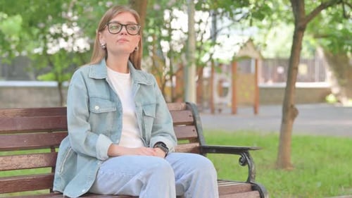 Waiting Young Woman Checking Wrist Watch on Park Bench