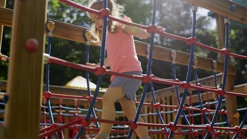 Cute Little Girl Joyfully Playing on an Outdoor Playground