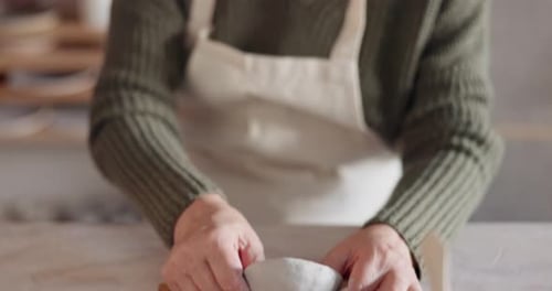 Pottery, art and senior asian woman mold clay in home studio or workshop