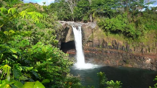 Rainbow Falls is a 80ft. tall waterfall on the Big Island of Hawai'i surrounded by the lush, green,